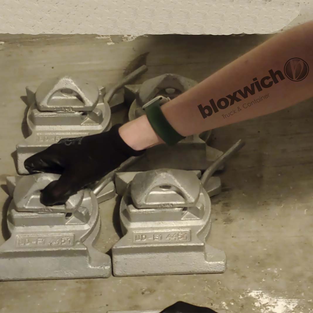 Member of the Bloxwich team with a Bloxwich tattoo handling some parts as part of a customer order.